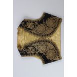 AN OTTOMAN TURKISH CHILD'S WAISTCOAT, black ground with gilt metal thread embroidery.