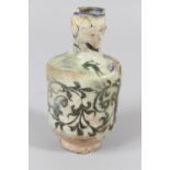 A SMALL PERSIAN QAJAR DYNASTY POTTERY VASE (A/F) 5ins high