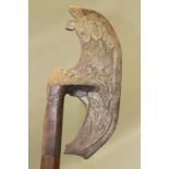 A PERSIAN TABARZIN STEEL AXE, engraved to one side with a bird head, a lion and serpent to the other