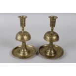 TWO 19TH CENTURY PERSIAN QAJAR ENGRAVED BRASS CANDLESTICKS