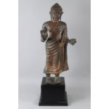 A LARGE STANDING BUDDHA in the GANDHARA STYLE on a stand. Buddha 29ins high