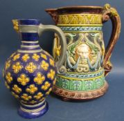 2 majolica jugs, Minton gothic revival mask  jug approx. 24cm & Rorstand jug decorated with lions