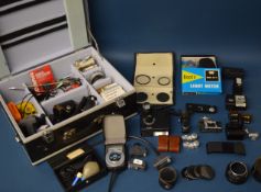 Large quantity of camera accessories and lenses in a Hasselblad case, including boxed Cobra D650 LCD