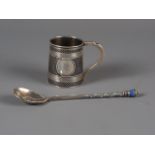 A Russian silver and niello mug, 2" high, and a Russian cloisonne enamel silver spoon, 3.3oz troy