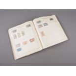 A 1920s/40s Strand stamp album, mostly British Colonial and Continental stamps
