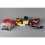 A die-cast Burego Porsche 996 Turbo, a Burego 1959 Jaguar Mk 2 a Maisto Ferrari 599, model