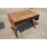 A late 18th century Marsh and Tatham style rosewood and line inlaid sofa table fitted two drawers