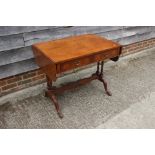 A walnut and banded sofa table, fitted two drawers, on carved display supports, 52 " wide x 23" deep
