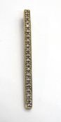 A 9ct gold modernist style bar pendant set with diamonds, hallmarked 375, 39mm in length, 1.