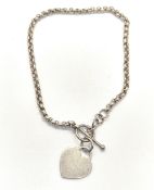 A silver bracelet having heart tag upon and stamped 925.