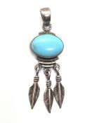 A Native American silver and turquoise dream catcher style pendant having makers mark to back and