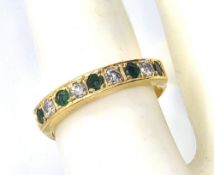 A classic half eternity emerald and diamond 18ct gold ring, size Q-R, 3.