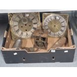 Two long case clock faces, weights and a lantern clock movement