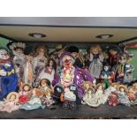 A collection of 20th century bisque headed dolls together with costume dolls