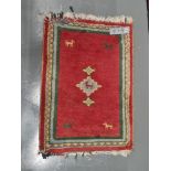 A Tribal oriental mat 90cm x 65cm