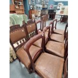 Five Regency mahogany side chairs with brown vinyl upholstery, two Victorian carved mahogany side
