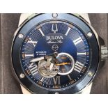 A Bulova Marine Star open-heart automatic wristwatch (model 98A302) boxed with a guarantee card.