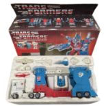 A boxed 1985 Transformers Optimus Prime play set [lacking one red rocket]