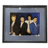 QUEEN: A framed and glazed signed photograph, as pictured on the 1989 Miracle album, with label