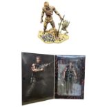 A boxed Arnold Schwarzenegger Commando figure by Neca, together with SOTA Toys "Now Playing"