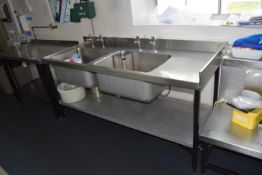 A stainless steel twin sink wash station, width 180cm, depth 70cm, height 86cm with under shelf