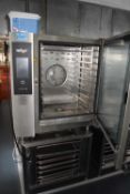 A Retigo Vision combi oven, model number B1011I together with a stainless steel stand with storage