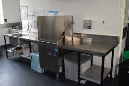 A complete pass through wash station to include stainless steel rinse off area with sink and tap,