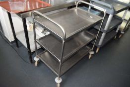 A stainless steel three tiered food trolley, height 93cm, depth 50cm, width 83cm
