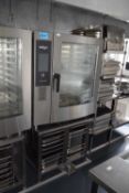 A Retigo Vision combi oven, model number B1011I together with a stainless steel stand with storage