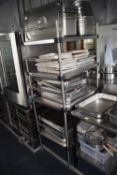A stainless steel storage rack, overall height approx 180cm, width approx 59cm, depth approx 78cm