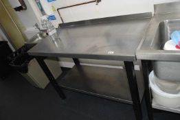 A stainless steel prep table, width 121cm, depth approx 61cm, height 85cm with under shelf and bavck