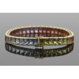 H Stern: an 18ct rainbow-hued multi gemset bracelet, each link comprised of a single gem, with an