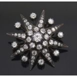 A Victorian diamond star brooch, set throughout with old mine cut diamonds, total estimated