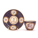 Sevres Style Jewelled Cup and Saucer the cup with inter- twined handle decorated with a portrait