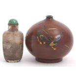 A globular Japanese bronze vase Meiji period decorated with two cranes in a landscape together