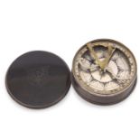 An antique sundial compass of circular form having two pull-off tortoiseshell covers the top with