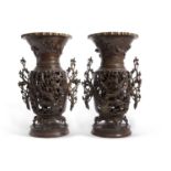 A large pair of Japanese Meiji period Usubata bronze vases, the handles formed as branches in bud,