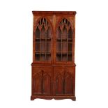 Victorian Mahogany Gothic Revival Bookcase Cabinet.The moulded cornice with ball mounts above a pair
