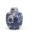 A large Chinese porcelain jar and cover decorated with Chinese figures in a garden setting, double