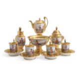 A 19th Century Paris porcelain part coffee set circa 1870, gilt decorated with painted reserves of