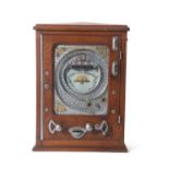 An early 20th Century penny slot machine, the face marked For Amusement one penny Try It, 66cm high