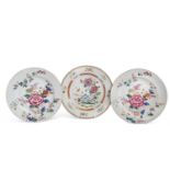 A pair of 18th Century Chinese porcelain plates decorated in Famille Rose style together with a