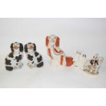 Collection of three Staffordshire dogs, further Staffordshire model of Scottish girl with sheep