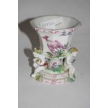 An 18th Century Bow porcelain vase painted with birds, the vase flanked by three putti (a/f), 10cm