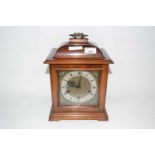 A 20th Century Smiths bracket clock, the square dial with pierced spandrels, Roman and Arabic