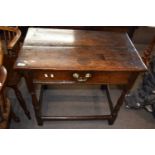 An 18th Century oak single drawer side table raised on turned legs with an all round stretcher