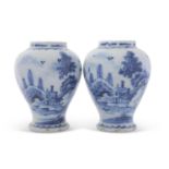 Pair of 18th Century Dutch Delft vases with floral decoration one vase with 2 rim chips and glaze