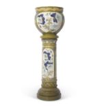 An impressive Burmantofts jardiniere and stand decorated in Majolica type glazes, the base impressed