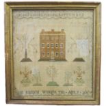 An early 19th century needlework picture, with alpha numeric stitching, a manor house and trees,