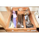 A cutlery tray and assorted utensils